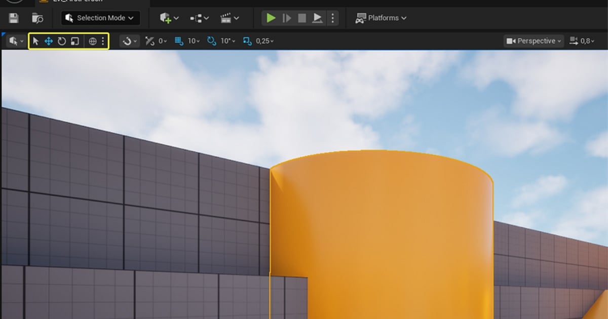 The top toolbar of the Unreal Engine editor interface. A yellow box highlights the transform tool icons used for selecting, moving (translating), rotating, and scaling objects. Below the toolbar, the 3D viewport displays simple grey, grid-patterned blockout geometry and a smooth orange cylinder against a blue sky with clouds.