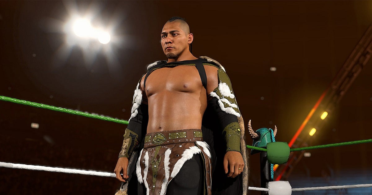WWE 2K26 screenshot showcasing a heavily detailed custom wrestler standing inside the ring under dramatic arena lighting, featuring realistic skin textures, advanced character modeling, and elaborate Viking-inspired attire with fur armor and championship-style accessories.