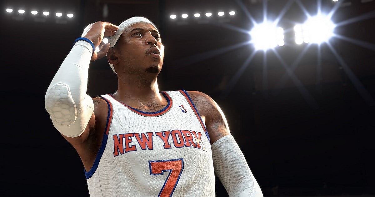 NBA 2K26 screenshot featuring Carmelo Anthony in his iconic New York Knicks jersey under the bright arena lights, capturing a cinematic pre-game moment with realistic player details, sweat reflections, and next-gen lighting effects.