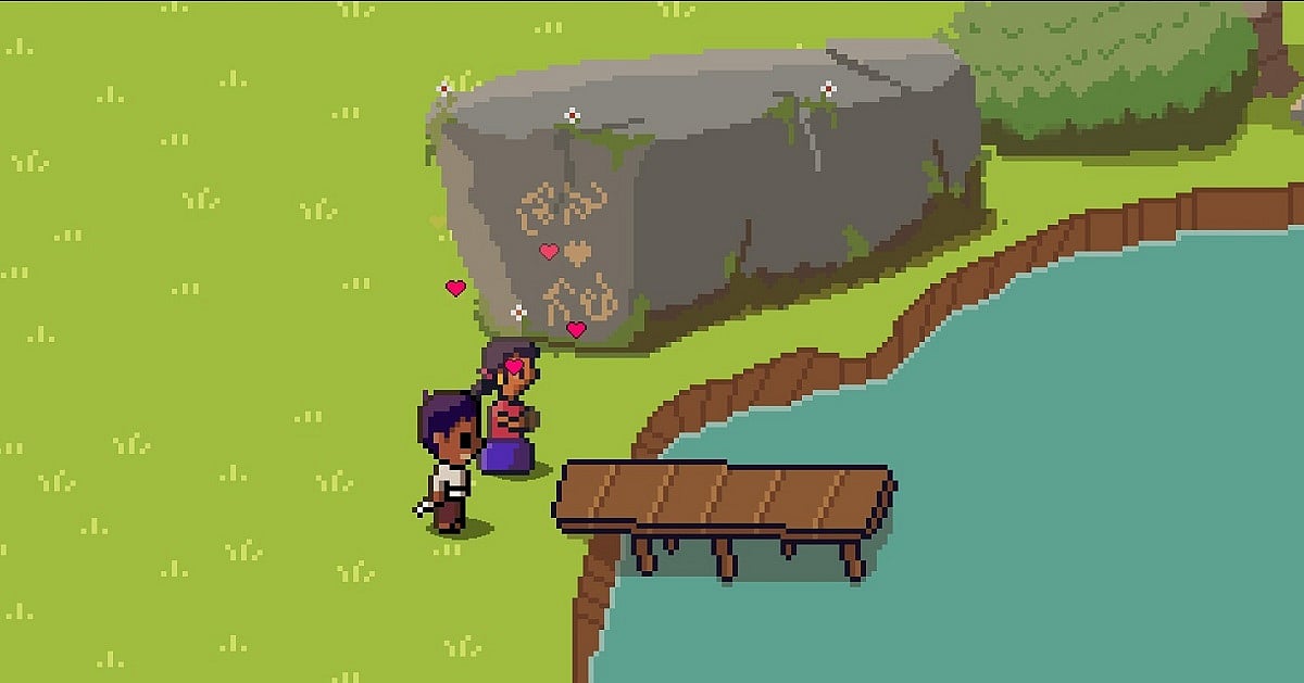 Pixel-art gameplay from Palm Sugar: A Village Story showing two characters standing beside a wooden dock overlooking a calm lake, with pink heart icons floating above them. A large stone engraved with decorative carvings sits behind them, surrounded by bright green grass, trees, and shrubs.