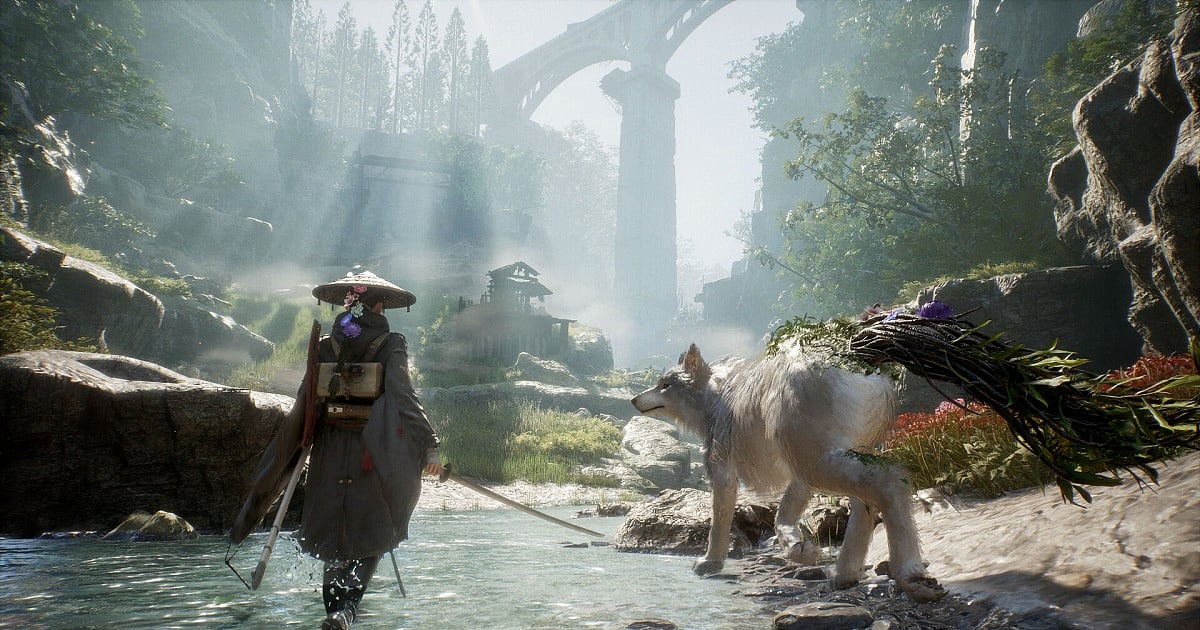 A screenshot from Beast of Reincarnation featuring the protagonist in traditional Japanese clothing and a wide straw hat. They walk through a shallow stream beside a large white wolf, while sunlight filters through a misty forest valley with towering ruins and bridges in the background.