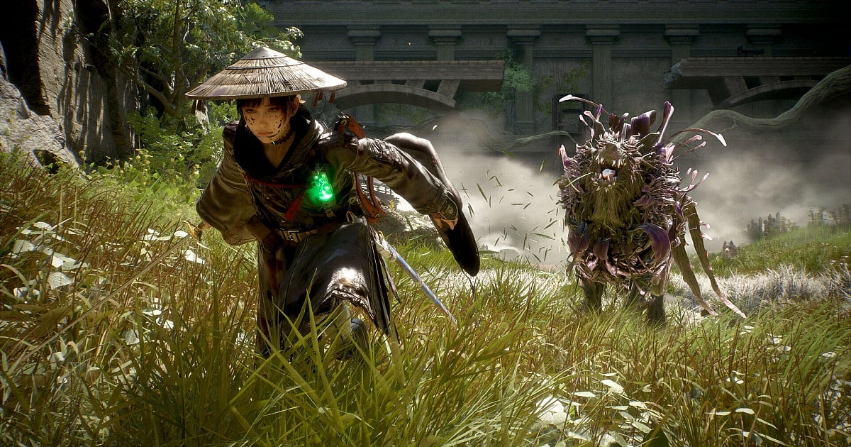 An in-game screenshot from Beast of Reincarnation, developed by Game Freak. The image shows the protagonist Emma exploring the game's open world featuring large grassy areas while being chased by Koo, her blighted dog who is looking at her.