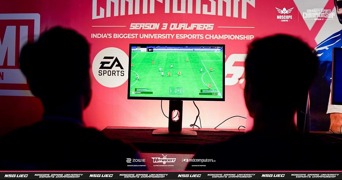 A promotional image for UEC Season 3. It features two gamers at a live event playing EA FC 26 on a monitor in a competitive setting.