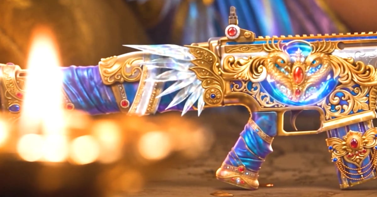 A blue and gold SCAR-L rifle featuring ornate peacock-inspired detailing and jeweled accents.