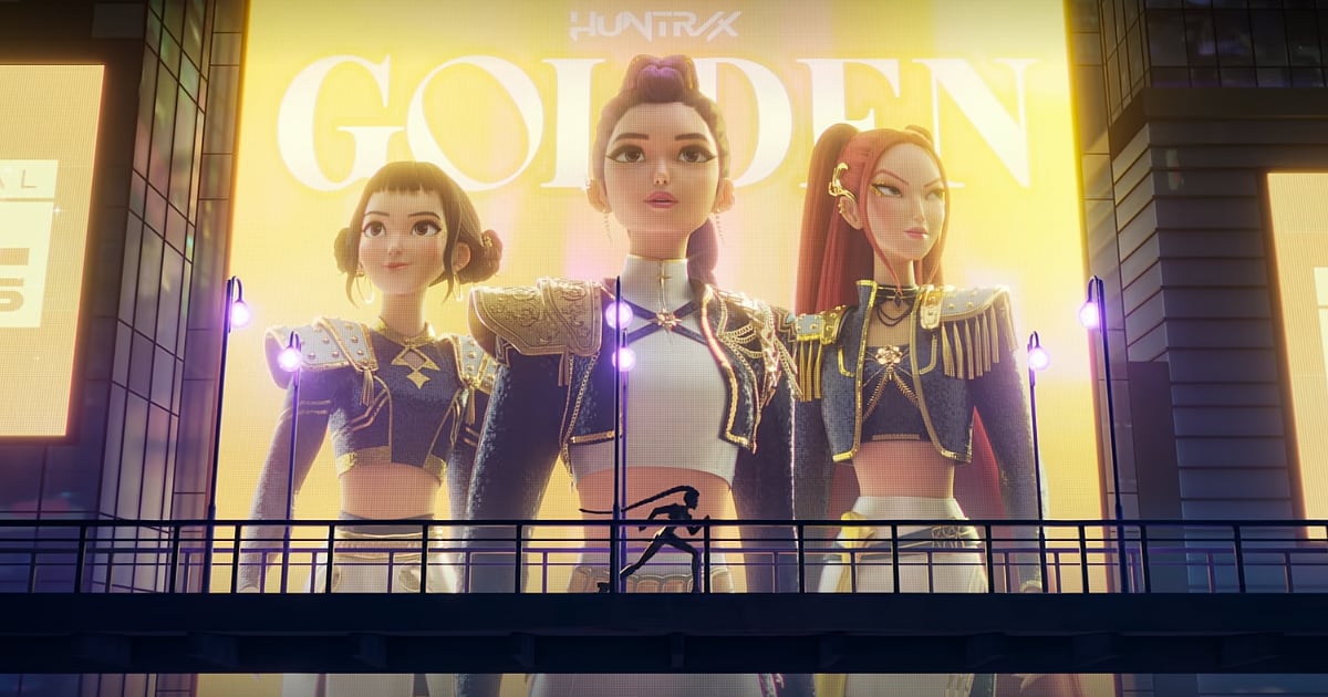 HUNTR/X members Rumi, Mira, and Zoey appear on a giant digital billboard during the “Golden” scene in KPop Demon Hunters.