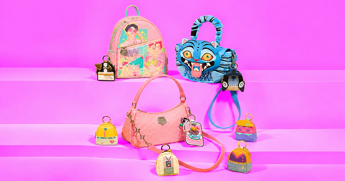 KPop Demon Hunters-themed Loungefly merchandise featuring a Saja Boys mini backpack, Derpy Tiger bag, pink handbag, and colorful mini backpack charms displayed against a bright pink background.