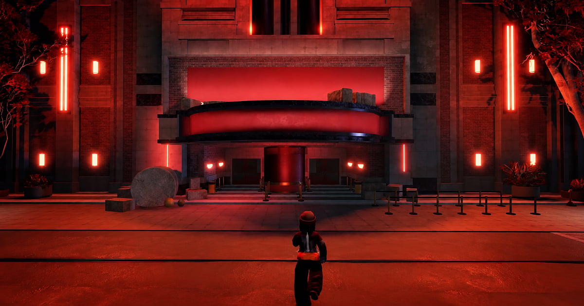 Roblox Halloween event scene featuring a character approaching a large building illuminated by red neon lights at night.