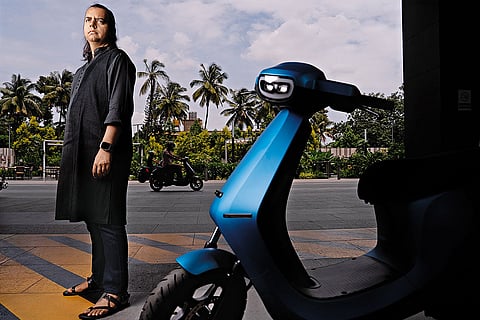 Bhavish Aggarwal with his Ola Electric scooter in frame