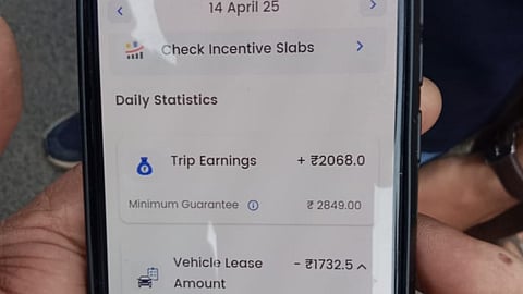 A driver shows the vehicle lease amount deducted on April 14