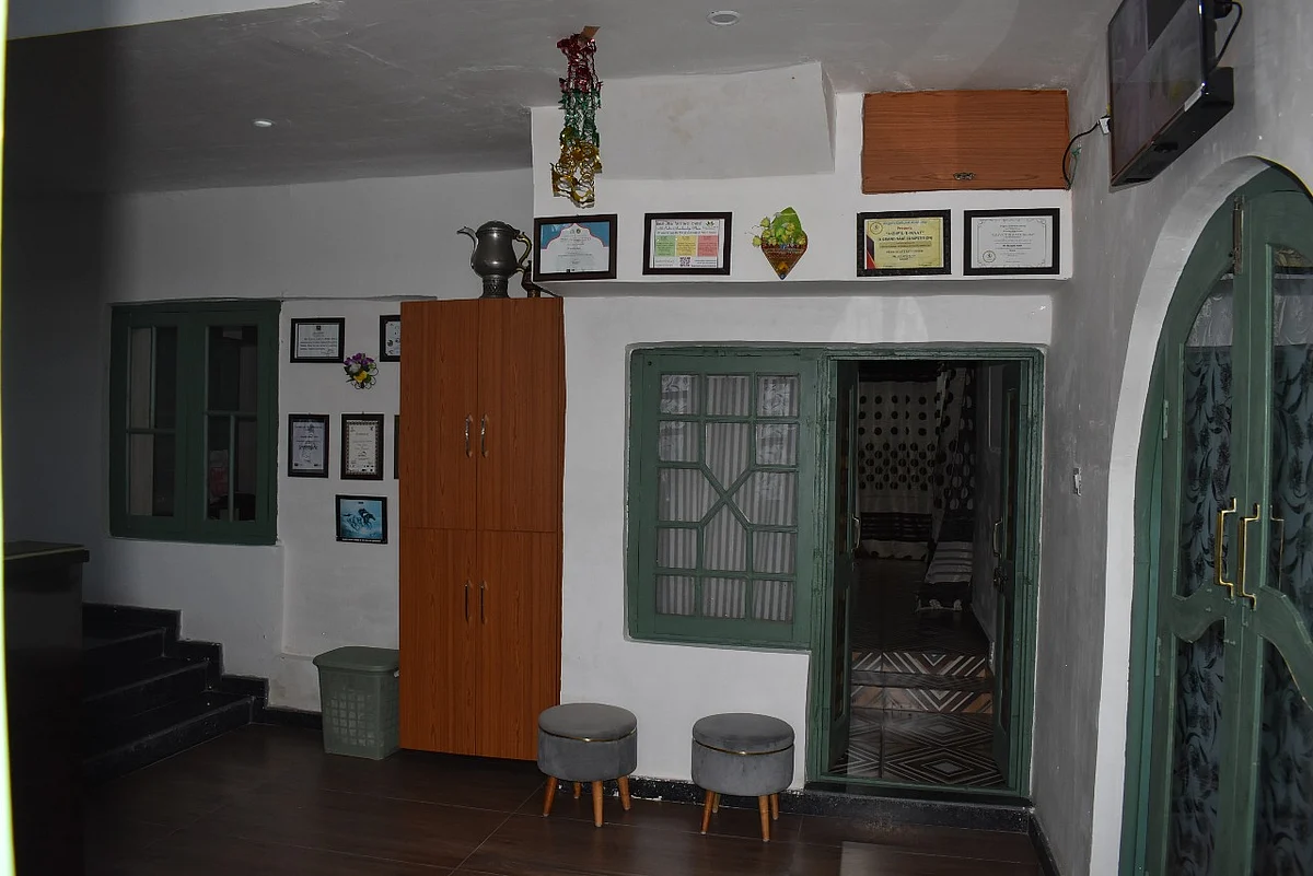 Musadiq Alam's living room, once crowded, now screams with silence