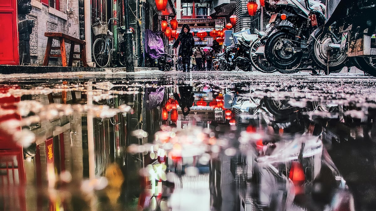 Photo by zhang kaiyv : Floodwaters submerge homes and roads in Meilin township, Guangxi, on June 26 as the region braces for more rain from an approaching tropical storm.