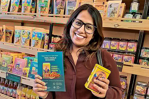 A customer selects items at a Kiwi Kisan Window store