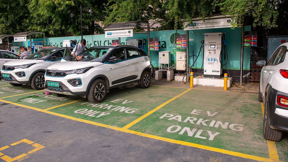 Electric vehicles being charged at a public charging station in New Delhi