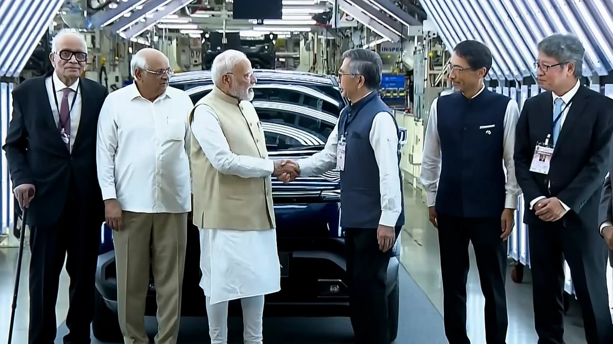 Photo by PTI : PM Modi at the launch of Maruti Suzuki’s first EV, e-Vitara, in Gujarat