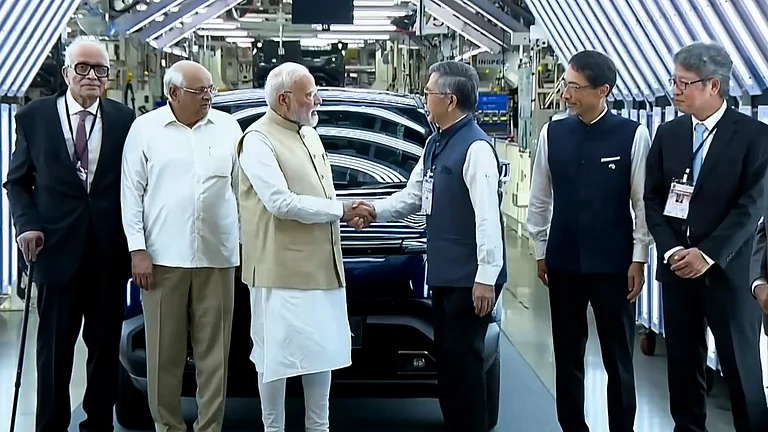 PM Modi at the launch of Maruti Suzuki’s first EV, e-Vitara, in Gujarat - Photo by PTI