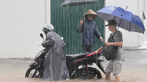 Flooded streets in Hanoi after Typhoon Kajiki lashes Vietnam with fierce winds and heavy rains