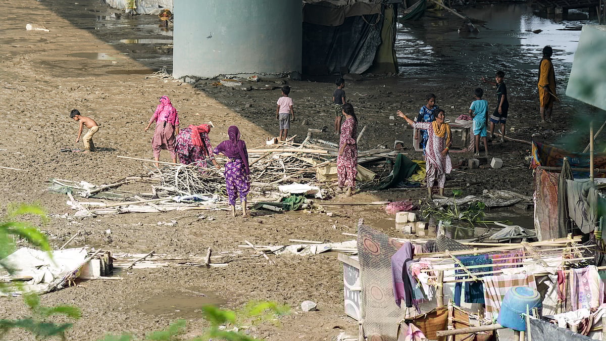 Photo by PTI : Areas near Yamuna Ghat as water levels recede in Delhi