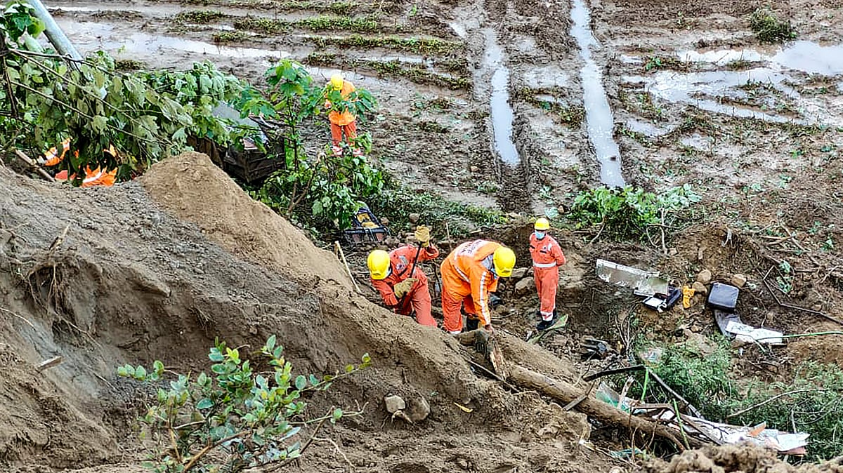  Photo by PTI : Rescue teams at the landslide site in Himachal Pradesh after heavy rains