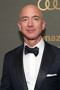 Why Jeff Bezos Is Urging Consumers & Businesses to Delay Spending Amid Economic Fears X