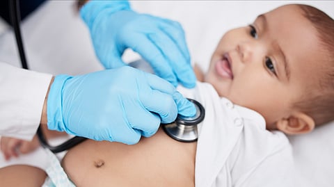 A baby undergoing a lung checkup in a hospital