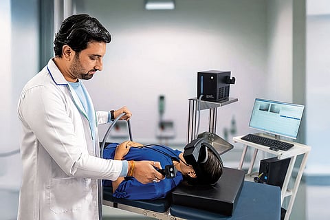 A NeuroEqilibrium doctor demonstrates vertigo and balance-disorder treatment