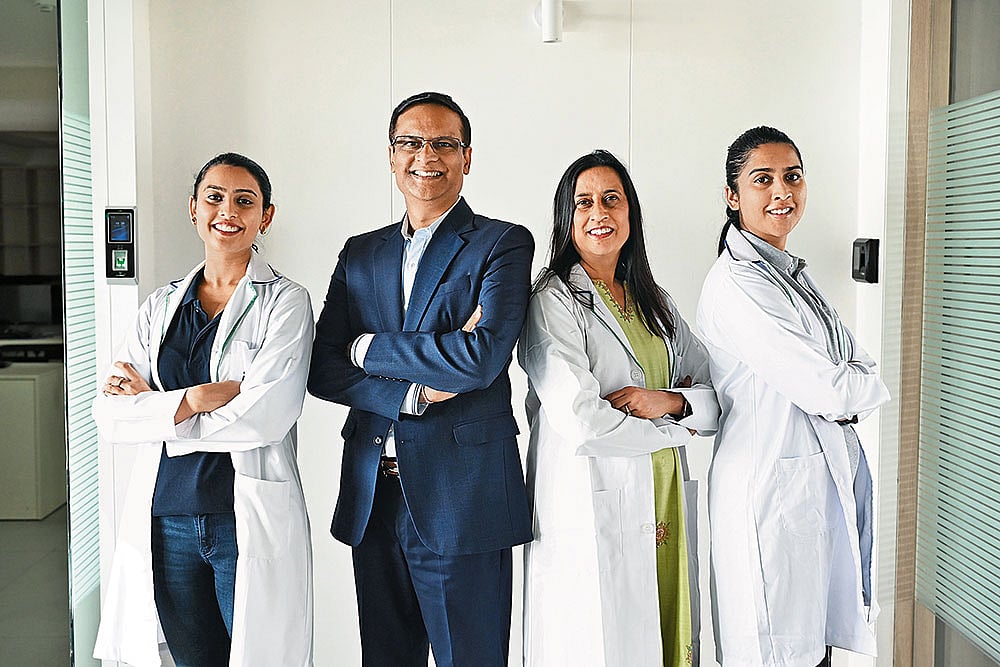 Rajneesh and Dr Anita Bhandari (centre) with colleagues - null
