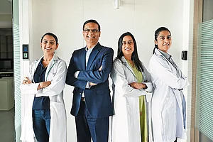Rajneesh and Dr Anita Bhandari (centre) with colleagues