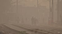 Delhi’s Air Quality Is Back in the ‘Severe’ Zone, Kiran Bedi, Cars24 Founder Demand Action from PMO Photo by PTI : Residents walking in dense smog due to severe air pollution in Delhi