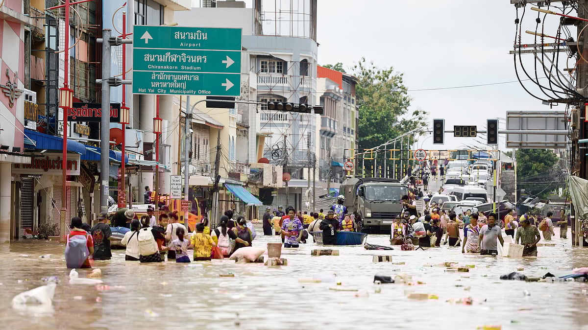 Rescue teams work amid floodwaters in Southeast Asia after devastating cyclones - Image by AP