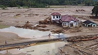 Climate Change Supercharged November Storms Across Asia, Says Report Photo by Associated Press : Relief workers navigate floodwaters caused by supercharged tropical storms in Southeast Asia