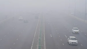 Smog blankets an Indian city as commuters navigate heavy traffic pollution