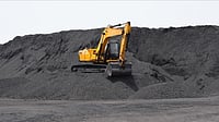 Rajasthan May Need 4,400 MW New Coal Capacity by 2036 Despite Being Top Renewables Producer – Here’s Why Digger working on the bulk mountain of coal