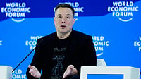 Photo by AP/Markus Schreiber : Elon Musk attends the Annual Meeting of the World Economic Forum in Davos, Switzerland on January 22