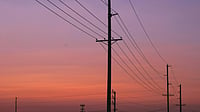Rising Power Demand Puts Focus on Demand Flexibility — Here’s Why Photo by Chase Crawford : Power transmission lines against a sunset as India’s electricity demand rises