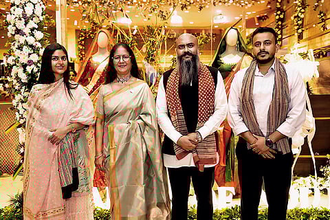 Darshan Dudhoria (2nd from right) with customers at a store