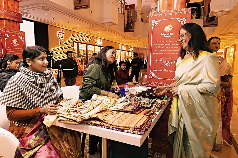 An artisan (left) at a store