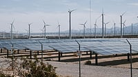 Photo by Kindel Media : Wind turbines and solar panels at a hybrid renewable energy site