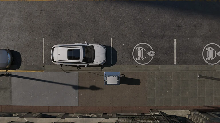 Electric vehicles charging at a public station as India scales mobility transition - null