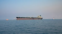 Oil tanker passes through the Strait of Hormuz, a crucial global energy shipping route