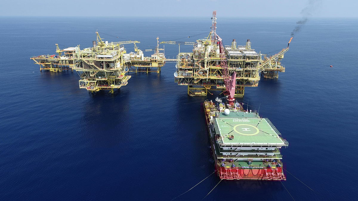 Aerial View of Oil Rig out at Sea - Photo by Aron Razif