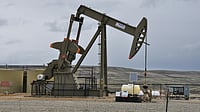 Crude Oil Dips Slightly but Still Holds Near $100 Amid Iran War — Here’s Why Photo by Tom Fournier : Oil pump jacks as crude prices remain volatile globally
