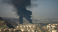 Photo by AP : Fire and plumes of smoke rise from an oil facility in Fujairah, United Arab Emirates