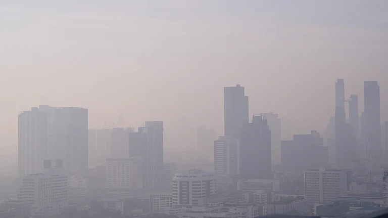Smog blankets a city skyline amid worsening global air pollution levels in 2025 - null
