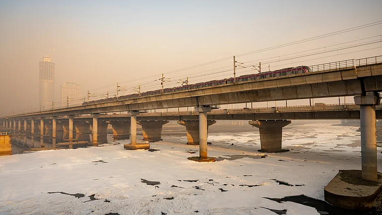 Untreated sewage flows through a drain into the Yamuna River in Delhi - null