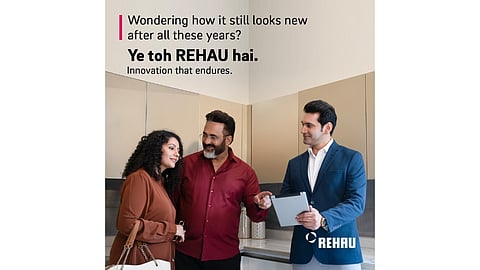 Couple and consultant discussing REHAU kitchen