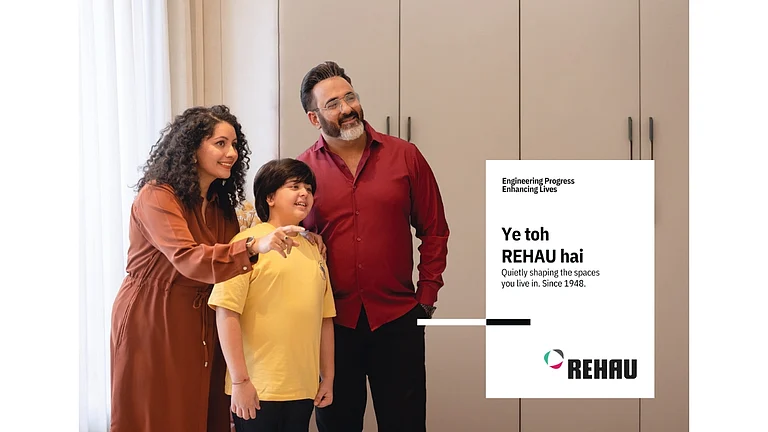 A family smiling in front of REHAU cabinetry - null