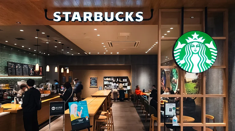 Starbucks store exterior symbolising global restructuring and technology layoffs - null