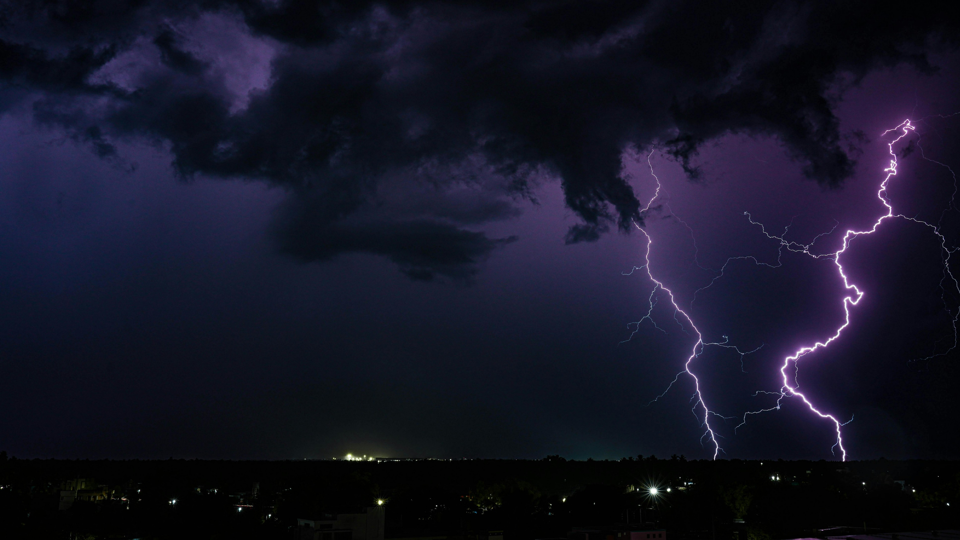 Dark storm clouds build over heat-hit regions - null
