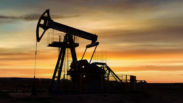 Indian economy outlook shown with oil barrels, rupee symbol and growth charts - null