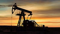 Indian economy outlook shown with oil barrels, rupee symbol and growth charts